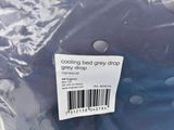 a bag of blue bedding with white polka dots on it
