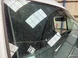 a car that has a lot of stickers on the windshield