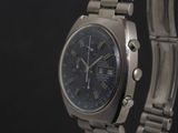 a close up of a watch on a metal bracelet