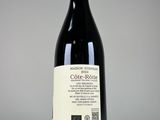 a bottle of wine that is sitting on a table
