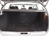 the back of a car with its trunk open showing the cargo compartment