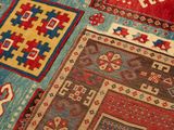 close up of a colorful oriental rug on display in a museum