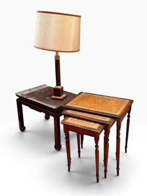 two tables with a lamp on top of them and a table with a lamp on top of it