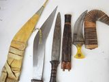 many different types of knives on the table