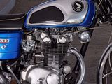 a blue and black motorcycle parked in a parking lot