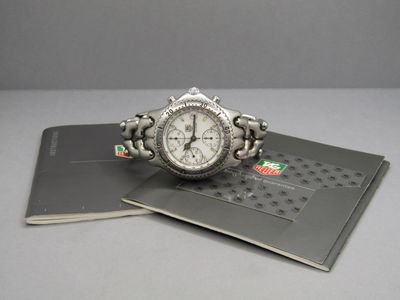 a watch that is sitting on top of a book
