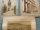 three old black and white photos of a street with columns