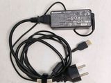 a close up of a laptop charger with a cord attached to it