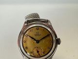 an image of a close up of a wrist watch on a table