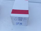 a box with a red stripe on it sitting on a white surface