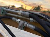 a lot of hoses that are attached to a rail
