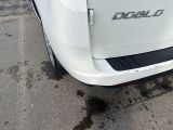 a close up of a white truck parked in a parking lot