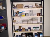 a shelving with many items on it in a room