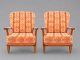 paire de fauteuils rembourrés à rayures orange, avec accoudoirs et pieds