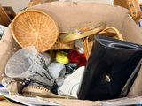 a basket full of assorted items sitting on a table