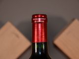 a bottle of wine that is sitting on a table