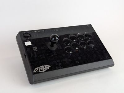 an image of a close up of a controller on a white surface