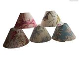 four lampshads with different designs on them on a white background