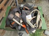 a box full of shoes and other items on the ground