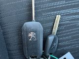 a car key and a car keychain on the seat of a car
