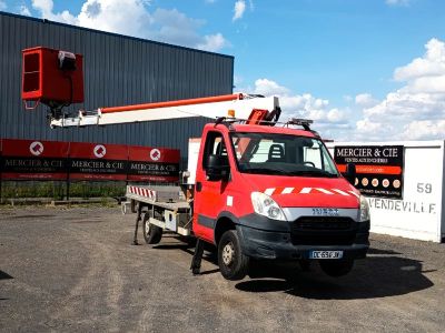 a red truck that is parked in front of a building