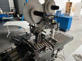 an image of a machine that is working on a piece of paper