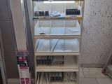 a rack with a lot of items on it in a room