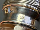 a close up of a silver plate with a napkin on it