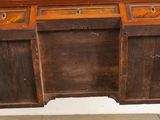 a wooden desk with two drawers on top of it