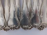a lot of spoons that are sitting on a table