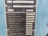 a sign on the side of a blue machine