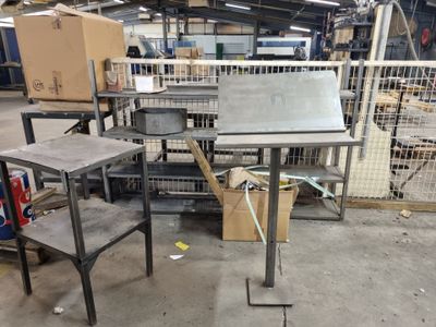a metal table with a metal top in a warehouse