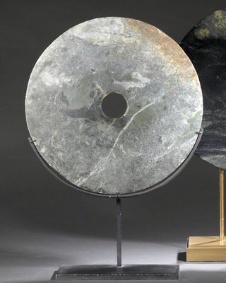 two pieces of art that are sitting on top of a table
