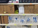 many boxes and packages on the shelves in the store