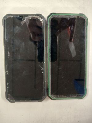 two mirrors on the wall with a person taking a picture of them