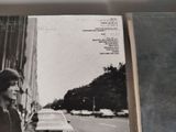 a book with a picture of a woman walking down the street