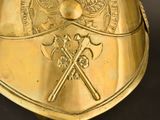 a gold helmet with two crossed swords on it