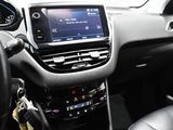 the interior of a car with a steering wheel and dashboard controls