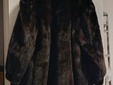 a picture of a fur coat hanging on a wall