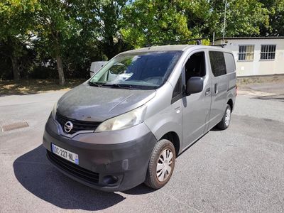 a silver van that is parked in the parking lot