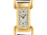 une photo d'une montre-bracelet plaquée or avec un bracelet en cuir marron