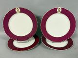pair of purple and white plates with gold trims on them