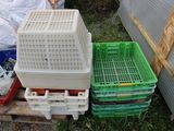 many plastic containers sitting on a pallet in the yard
