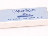 une image représentant une carte de briquet sur laquelle figure un bateau