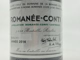 a bottle of wine that is sitting on a table