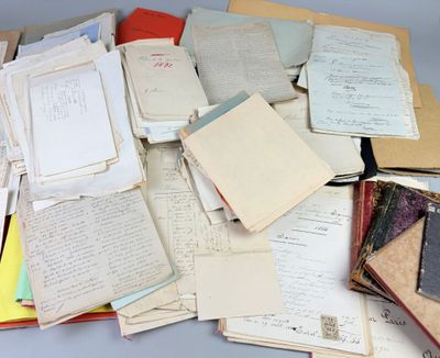 a pile of old books and papers on a table
