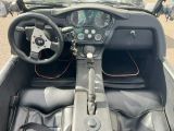 a dashboard and steering wheel of a car