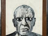 une image représentant un tableau représentant le visage d'un homme dans un cadre