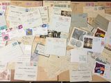 a suitcase full of letters and postcards sitting on a table