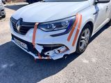 the front end of a white car with orange stripes on it